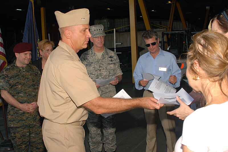 File:US Navy 100715-N-4971L-017 Capt. Kurt Hedberg, left, mission commander of Southern Partnership Station 2010, hands out information pamphlets.jpg