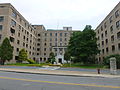 Detail of main entrance of University Crossing (former Saint Joseph's Hospital), a building of the University of Massachusetts, Lowell. Located at 220 Pawtucket Street, Lowell, Massachusetts.