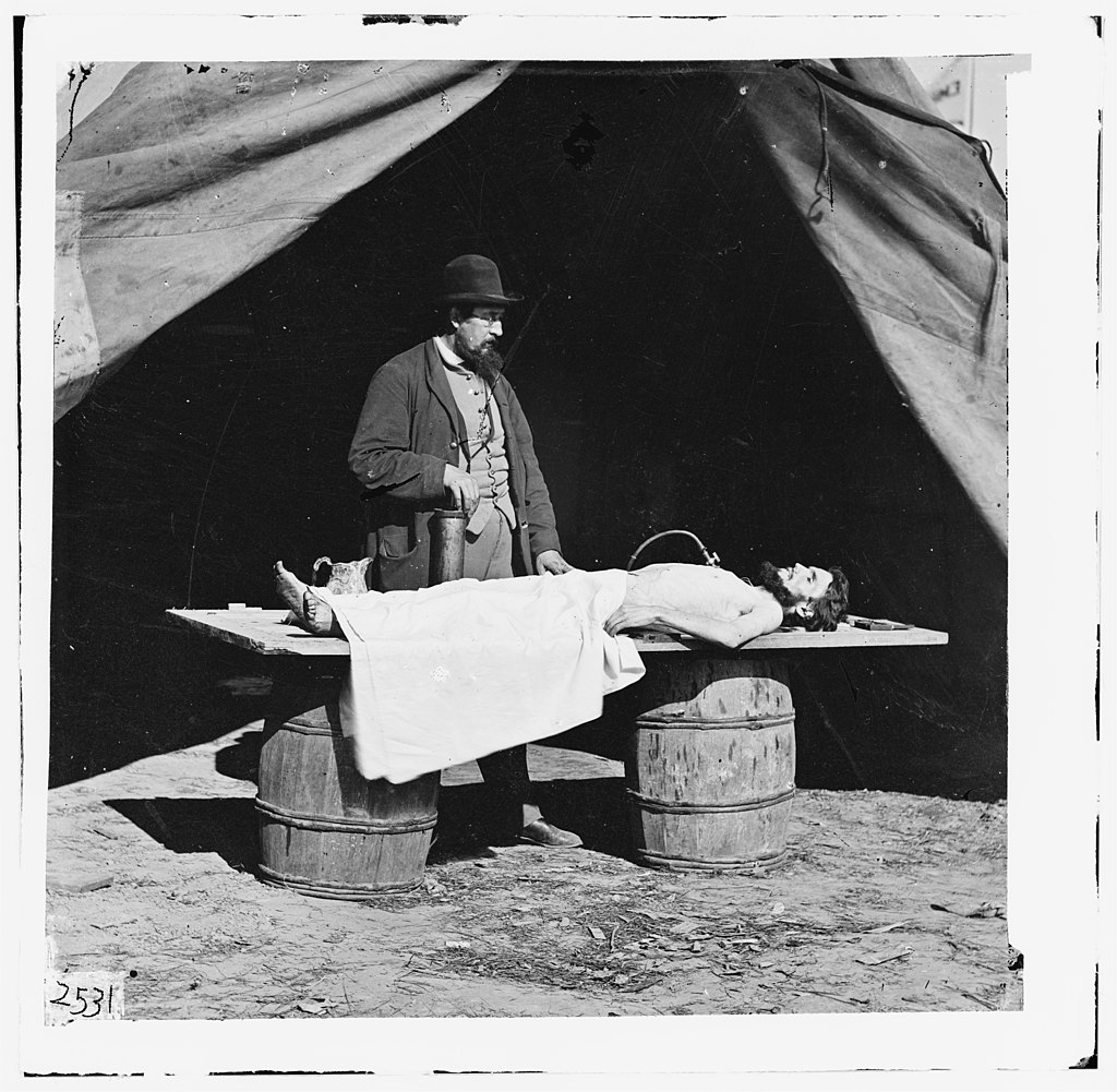 Unknown location. Embalming surgeon at work on soldier's body LOC cwpb.01887