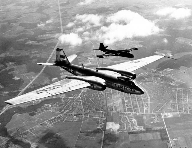 Martin RB-57D 53-3977 shown in-flight with a Tactical Air Command B-57A bomber (black plane in this formation)