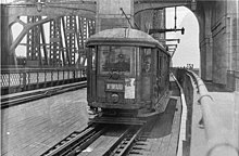 Wynyard-bound tram on Harbour Bridge, 1930-1939, Ted Hood Wynyard-bound tram on Harbour Bridge (now twin roadways to Cahill Expressway), 1930-1939 - by Ted Hood (21698177499).jpg
