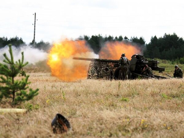 National Guard troops firing artillery