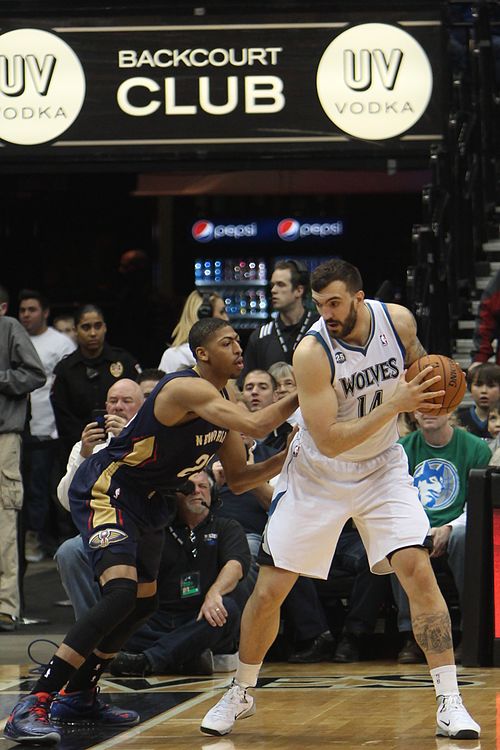 Peković guarded by Anthony Davis in 2014