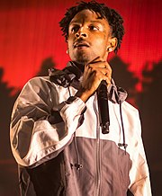 "Psilocybae (Millennial Love)" is the third collaboration between Glover and 21 Savage after their 2018 tracks "This Is America" and "Monster". 21 Savage 2018.jpg