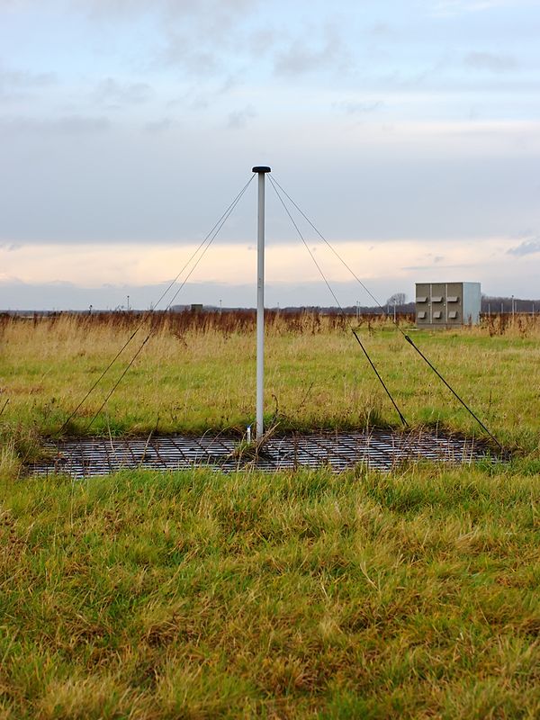 Low-band antenna with electronics cabin in the background