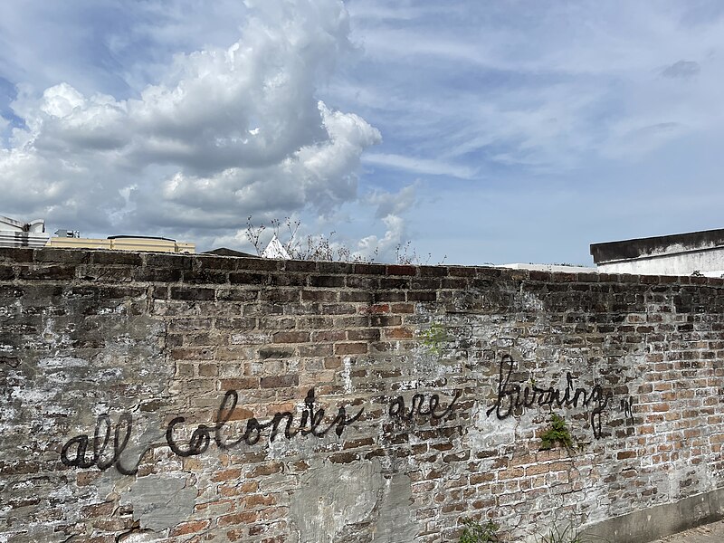 File:All colonies are burning - brick wall New Orleans.jpg