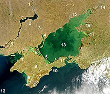 Satellite image of Sea of Azov. The shallow Sea of Azov is clearly distinguished from the deeper Black Sea. Numbers: 1. Dnieper River, 2. Kakhovka Reservoir, 3. Molochna River, 4. Molochnyi Lyman, 5. Arabat Spit, 6. Syvash lagoon system, 7. Karkinit Bay, 8. Kalamitsky Bay, 9. Crimea, 10. Fedosiysky Bay, 11. Strait of Kerch, 12. Black Sea, 13. Sea of Azov, 14. Don River (Russia), 15. Taganrog Bay, 16. Yeysk Liman, 17. Beisug Liman AzovseaNASA2.jpg