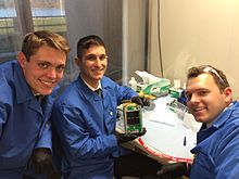 BRICSat-2 assembly. L to R Midshipmen Eilinger, Furseth, and Cumberland. BRICSat-2 Assembly.jpg