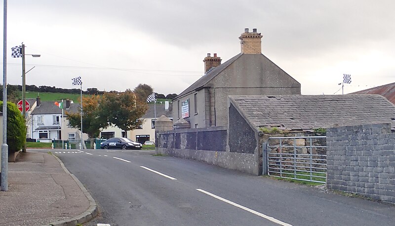 File:Ballymoney Road approaching its junction with the A25 in the centre of Kilcoo - geograph.org.uk - 5937150.jpg