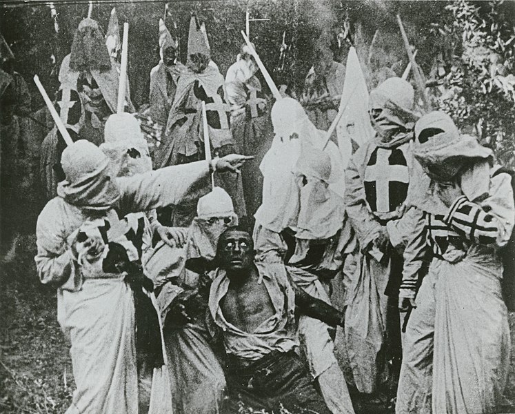 File:Birth-of-a-nation-klan-and-black-man.jpg