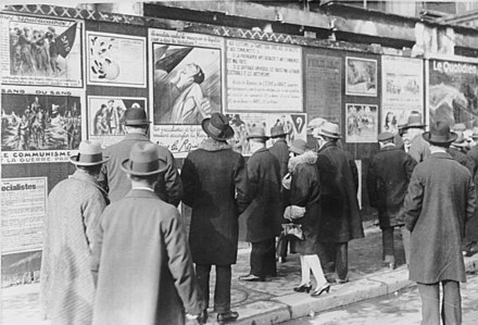 Campaign posters in the streets of Paris, 1928. Bundesarchiv Bild 102-05349, Paris, Wahlplakate.jpg