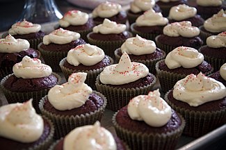 Chocolate cupcakes with frosting and red sprinkles