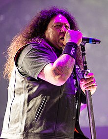 Billy performing with Testament in 2014
