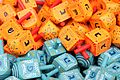 Colorful dreidels for sale in Machne Yehuda market, Jerusalem with Israel specific lettering on blue dreidels and diasporah lettering on orange dreidels