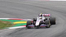 Schumacher driving the Haas VF-21 at the 2021 Austrian Grand Prix with a Russian flag-stylized livery FIA F1 Austria 2021 Nr. 47 Schumacher (corner).jpg