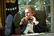 George W. Bush with his feet on desk.jpg