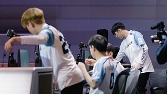 Guangzhou Charge players setting up prior to their match against Dallas Fuel in 2019. Guangzhou Charge taking the stage.jpg