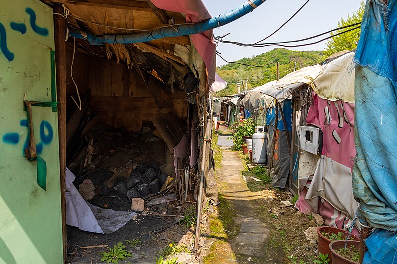 File:Guryong village coal briquet storage and an alley.jpg