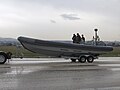 A boat of the Hellenic Coast Guard towed for a parade.