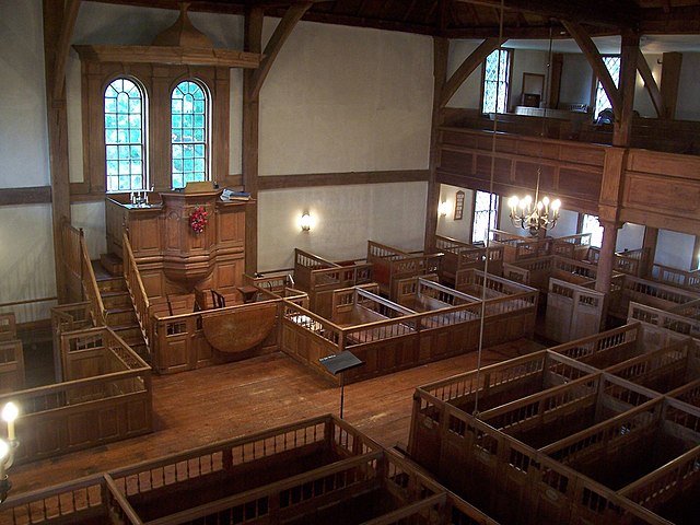 Interior of the Old Ship Church, a Puritan meetinghouse in Hingham, Massachusetts. Puritans were Calvinists, so their churches were unadorned and plai
