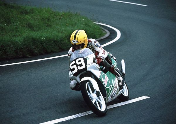 Dunlop on a Honda RS125 exiting the Gooseneck, a bend at the start of the mountain section of the Isle of Man TT course