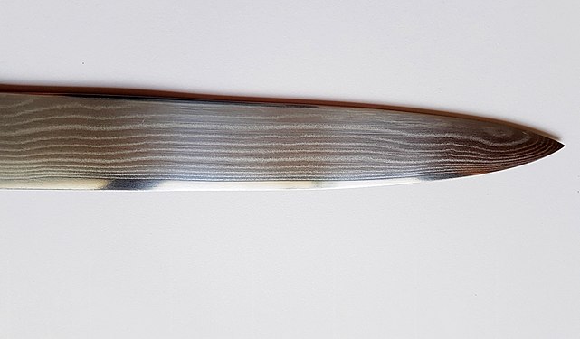 blade of a kitchen knife made of Damascus steel