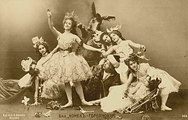 Photo of cast members of the Bolshoi Theatre in Alexander Gorsky's revival of The Little Humpbacked Horse. In the center of the photograph are Lyubov Roslavleva as the Tsar Maiden (front, standing), Vasily Tikhomirov as the Humpbacked Horse (center, back) and Nikolai Domashev as Ivanushka (center, reclining). Moscow, 1901. Little Humpbacked Horse. Gorsky version, 1901.jpg