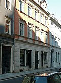 Residential house in closed development and rear building