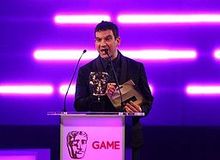 Miles Jacobson presenting the Sports & Fitness category at BAFTA Games Awards 2012.jpg