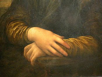 Detail of Lisa's hands, her right hand resting...