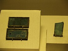 Blue glass plaques found in the Mausoleum of the Nanyue King, dating from late 2nd century BCE Nanyue flat blue glass.JPG