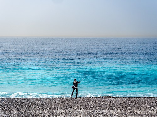 Angler on the beach of Nice