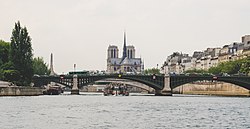Notre-Dame de Paris and Pont de Sully, Paris September 2015.jpg