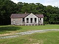 Old building at Bethel Grove Baptist Church cemetery, located near 6292 Mt Laurel Road, Clover, Virginia. West side shown. The building seems like it might have been an old school.