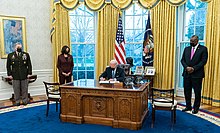 President Biden signs an executive order overturning the transgender military ban imposed by the Trump administration. P20210125AS-0362 (50912463336).jpg