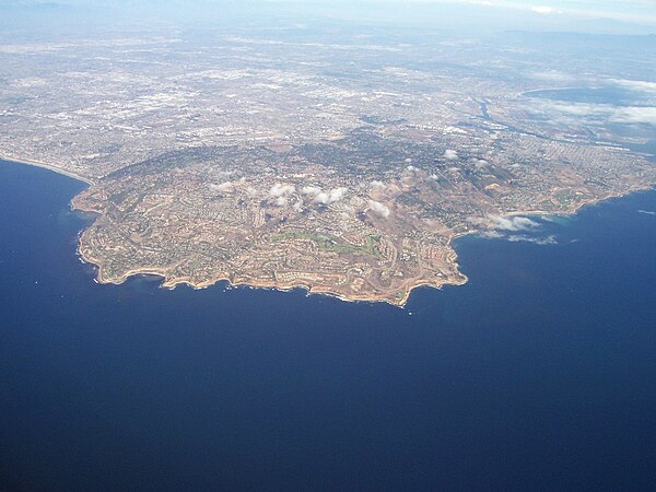 Aerial view of the Palos Verdes Peninsula and the Palos Verdes Hills, with Los Angeles city center in the distance