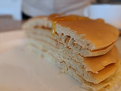 Pancake stack cut on half with honey.jpg