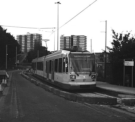 Supertram no. 17 on a test run at Spring Lane tram stop in 1994, with Guildford (left) and Shrewsbury towers behind.
