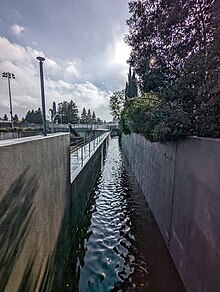 Permanente Creek where it can overflow (to the left) into the McKelvey Park retention basin.