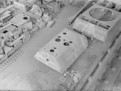 Parts of an unfinished armored vehicle taken at the Krupp steel works in Essen in May 1945 after the war. The VK 36.01's turret is lined up, along with the hull and turret of the Panzer VIII Maus super-heavy tank and the Jagdtiger gun mantlet. Pz VIII Maus factory.jpg