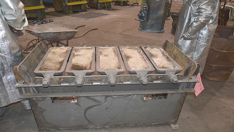 File:Re-melted tin affected with tin pest is poured into ingot molds at Rock Island Arsenal Joint Manufacturing and Technology Center, DVIDS3878892.jpg