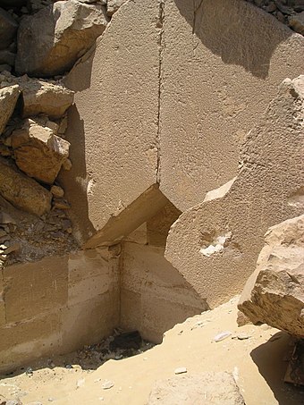 The funerary chamber of the queen's pyramid exposed by stone robbers