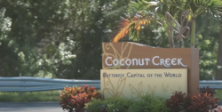 Sign for Coconut Creek, Florida "Butterfly Capital of the World".png