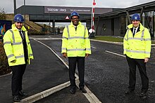 Houchen (right), with Business and Energy Secretary Kwasi Kwarteng (centre), at one of the entrances to the "Teesworks" site, in March 2021 Teesworks Business Secretary Visit.jpg