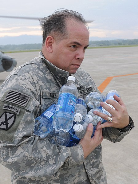 File:U.S. Army Lt. Col. Frederick Riker, deputy chief of Joint U.S. Military Assistance Group, stacks bottled water in a pile on the flight deck of USS Ronald Reagan (CVN 76) while under way in the Pacific Ocean 080625-N-HX866-004 (cropped).jpg