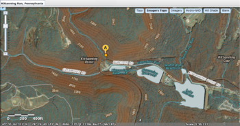 USGS combined topological and relief map mode view with search object 'Kittanning Run'. The Web software identifies the search item with short yellow point icon containing the 'A' (circled). This USGS confluence is several miles from the Kittanning Gap.
* The dark trace forming a hairpin turn directly below that marker is the Pennsylvania Railroad's Horseshoe Curve. USGS National Map viewer showing Kittanning Run, Pennsylvania location near Altoona--MIxed Mode topo+Sat.png