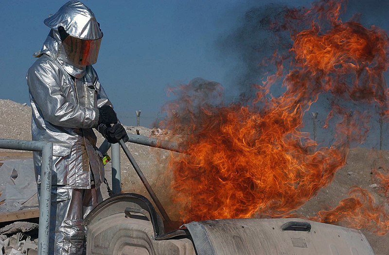 File:US Air Force (USAF) STAFF Sergeant (SSGT) Nathaniel Reed, a Firefighter for the 380th Air Expeditionary Wing (AEW), puts out a barrel-fire during his live fire fighting training - DPLA - 8f78d122b41cbf670cace7baca55fec9.jpeg