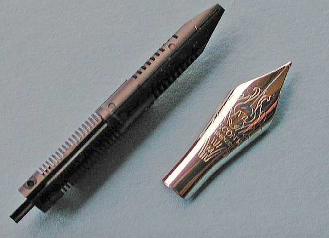 Detail of a Visconti stainless steel fountain pen nib and feed