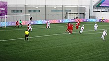 Turkey (red) vs Iran (white) at the 2010 Youth Olympics in Singapore Women football youth olympic games.JPG