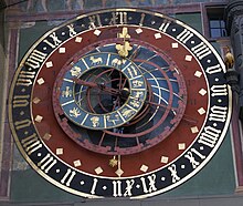 The astronomical clock of the Zytglogge in Bern shows the temporal hours on curved golden lines: respective end of the hour indicated with a black number. Zytglogge astronomical clock.jpg